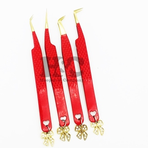 แหนบต่อขนตาแบบมืออาชีพ รุ่นขายดี ดีไซน์โบว์สีทอง ทนทาน ผลิตจากสแตนเลส พร้อมสายรัดสีแดง ใช้ได้กับขนตาปลอมมิงค์ - Product Image 1