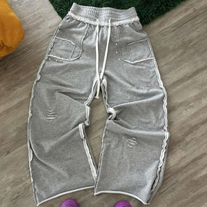 2025 nueva llegada de algodón pesado pantalones de chándal en blanco de gran tamaño para hombres pantalones de chándal holgados con dobladillo crudo lavado desgastado personalizado - Product Image 1
