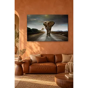 Impression sur toile : Fida, l'éléphant solitaire, marchant sur la route asphaltée - Product Image 1