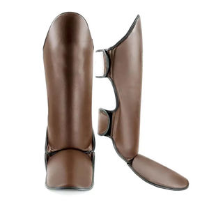 Espinilleras de Boxeo y MMA para Adultos NAMZA INTERNATIONAL de Cuero de Alta Calidad, Ligeras, Ajustables con Cierre de Gancho y Bucle, Básicas - Product Image 2