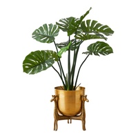 Jardinière en métal plaqué or antique avec base unique en forme de girafe, parfaite pour la décoration florale élégante du salon