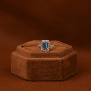 Fashionable Solitaire Blue <b>Emerald</b> Cut Lab Grown Diamond With Tiny Round Cut Diamond Halo Engagement <b>Ring</b> in 18KT Solid Gold - Product Image 1