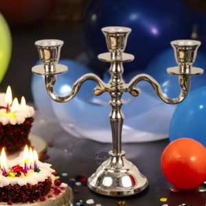 "Encantadores candelabros plateados de 3 brazos, ideales para celebraciones y reuniones íntimas, aportan elegancia y ambiente festivo" - Product Image 1