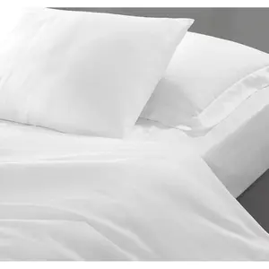 Beautiful double white bed linen set appreciates the comfort and coziness of the bedroom