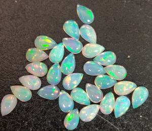 Pera de ópalo etíope natural Cabujón de 4x6mm Parte posterior plana-Excelente calidad Multifire Opal Pear Cabochon Gemstone - Product Image 5