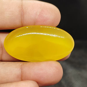 พลอยออนิกซ์สีเหลืองธรรมชาติคุณภาพสูง รูปทรงคาโบชอง ขัดเรียบ รุ่น UDGEMS หมายเลข 585 สำหรับทำเครื่องประดับ ขนาดคละไซส์ - Product Image 2