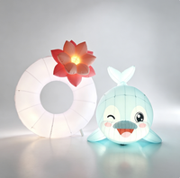 Ensemble de dauphins gonflables lumineux à LED personnalisés, anneau gonflable sur le thème de l'océan avec fleur de lotus