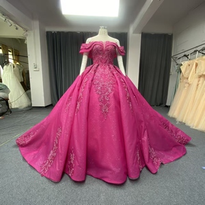 ANY269 Hermoso Vestido de Quinceañera Color Fucsia con Lentejuelas y Hombros Descubiertos - Product Image 1