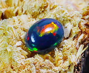 พลอยโอปอลแท้สีดำของชาวเอธิโอเปียอัญมณีโอปอลไฟกาแลคซีพลอยขัดเงาเรียบรูปไข่ทรงรีเอธิโอเปียนโอปอลทรงหลังเบี้ยสีดำ - Product Image 4