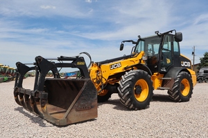 รถตักล้อยาง JCB TM390 สีเหลือง เครื่องยนต์ดีเซล สำหรับงานขนย้ายวัสดุในไซต์ก่อสร้างและไซต์หินผสม - Product Image 1