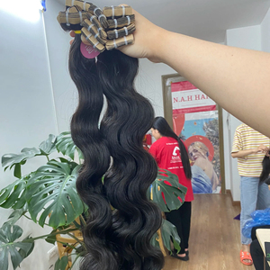 Cinta sin procesar en cabello humano, vietnamita y camboyano Extensión de cabello ondulado crudo directo de fábrica - Product Image 1