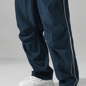 Pantalones de chándal de pierna recta personalizados al por mayor servicio OEM pantalones de jogging con cremallera lateral en blanco de poliéster pantalones acampanados holgados para hombres - Product Image 4