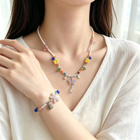 Ensemble collier et bracelet en perles de verre artisanales Boho Dopamine, bijoux colorés avec breloques papillon et feuille, cadeau pour femmes