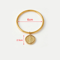 Bracelet rotatif double face avec portrait religieux, pendentif rond bicolore doré et argenté, fermoir en acier titane