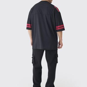 เสื้อฟุตบอลอเมริกันแขนสั้นระบายอากาศขนาดใหญ่พิเศษเสื้อเจอร์ซีย์สีทึบผลิตในปากีสถานโดย - Product Image 5