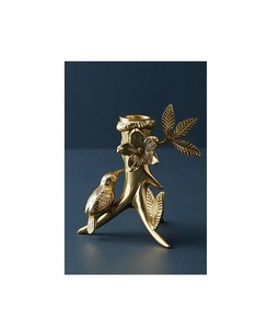 <b>Gold</b> tone metal <b>candle</b> holder with geometric design perfect for contemporary living room or luxury themed events - Product Image 1