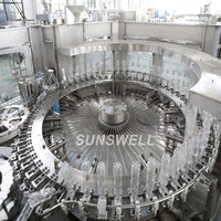 Machine automatique de remplissage et de bouchage de bouteilles de boissons gazeuses, d'eau, de bière, de fûts