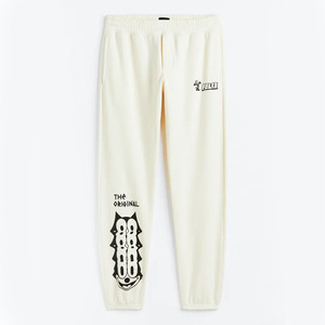 กางเกงวอร์มสำหรับวิ่งจ๊อกกิ้งรุ่นพื้นฐานสีเบจสำหรับผู้ชายมีสไตล์พิมพ์ลายหน้าจอออกแบบได้ตามต้องการและเอวยางยืด - Product Image 5