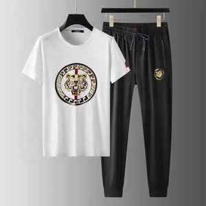 OSTROWEARS ENTERPRISES-Chándal de nailon de alta calidad para hombre, conjunto ligero impermeable de verano con pantalones cortos multibolsillos - Product Image 1