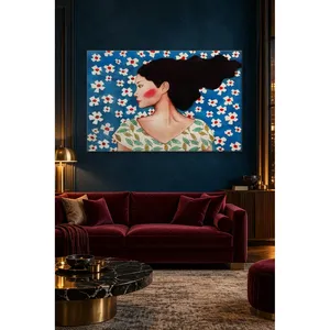 Impression sur toile Fida avec fond bleu, fleurs blanches et cheveux ébouriffés par le vent - Product Image 1