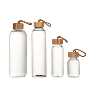 Eco-Friendly BPA-Free Durable <b>Glass</b> <b>Water</b> <b>Bottle</b> with Bamboo Lid Silk Screen Printed for Travel & Gym Use - Product Image 1