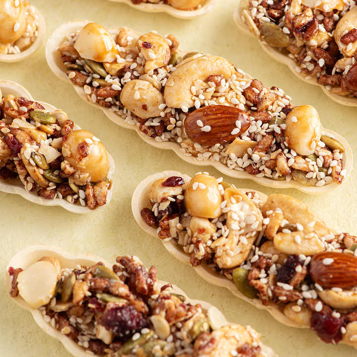 Nutritional Food Mixed Boat Cake with Almonds Cashews Pumpkin Seeds Brown Rice Oats Nutritious Breakfast Cereal