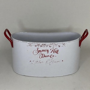 Jardinière creuse Santas conçue en finition métallique classique pour contenir les fleurs de la saison des vacances Poinsettias et les verts d'hiver avec style - Product Image 1