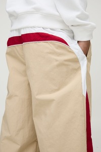 High quality 100% <b>nylon</b> men's pants custom DTF printed logo streetwear custom washed with side panals hip hop man pants - Product Image 2