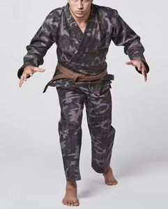 ชุดคาราเต้ผ้าฝ้ายคุณภาพสูงแบบยูนิเซ็กซ์ รับสกรีนโลโก้ ขายส่งชุดศิลปะการต่อสู้ ชุดเทควันโดสำหรับผู้ชายและผู้หญิง - Product Image 1