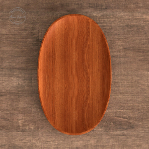 Plateau en bois de luxe moderne de forme ovale avec finition naturelle de qualité supérieure utilisé pour servir des plats et des collations et pour la décoration - Product Image 1