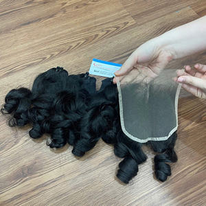 Paquets de cheveux bouclés rebondissants avec dentelle, vente en gros d'extensions de cheveux humains vietnamiens - Product Image 1