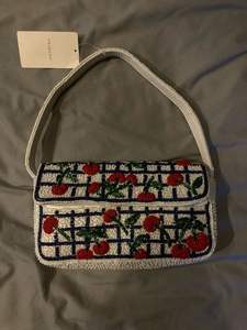 Sac à main chic en perles avec bandoulière en option - Product Image 1