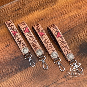 LLavero de regalo promocional de cuero mecanizado a mano, superventas, personalizado, pulsera de cuero genuino con concho de Metal para mujer - Product Image 1