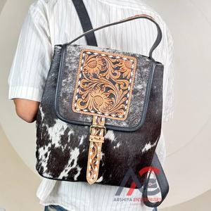 การออกแบบ ODM กระเป๋าเป้สะพายหลังของผู้หญิงหนังวัวเครื่องมือมือแฟชั่นยอดนิยมสำหรับการเดินทางและการเดินทางเป้สะพายหลังที่สะดวกสบาย - Product Image 1