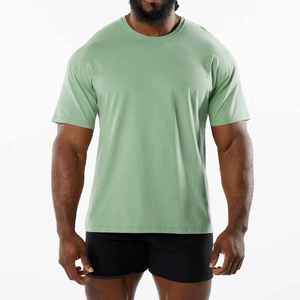 เสื้อยืดคอกลมสีทึบสำหรับผู้ชายเสื้อยืดผ้าฝ้ายถักเปิดไหล่ข้าง95% แบบลำลอง - Product Image 1