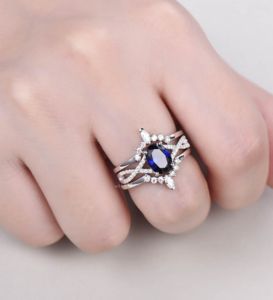 Ensemble de bagues de mariage 3 pièces-Bague de fiançailles en saphir bleu de coupe ovale avec bandes de moissanite double incurvées, bagues fines en argent 925 - Product Image 2