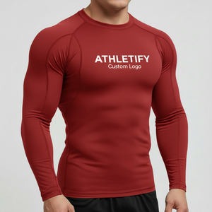 Camiseta de baño de compresión de secado rápido con logotipo personalizado Rashguard para hombre de primera calidad, ropa atlética cómoda para gimnasio y deportes acuáticos. - Product Image 1
