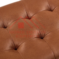 Pouf ottoman en cuir marron à capitonnage manuel