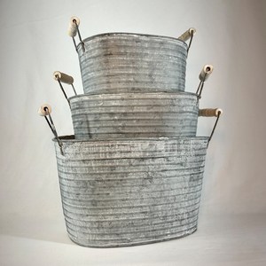 galvanized metal <b>planters</b>, designed with a rustic and corrugated appearance, featuring <b>wooden</b>-handled loops for easy carrying. - Product Image 4