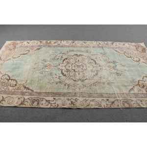 Tapis vintage 4,7 x 9,3 pieds, grand tapis turc, tapis à imprimé animal brun et vert - Product Image 3