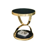 Table basse en fer de forme ronde au design antique, finition dorée, plateau en verre, table basse tendance pour la maison.