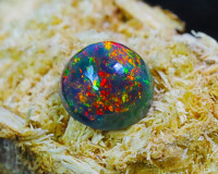 Impressionnant cabochon d'opale noire éthiopienne pierre précieuse forme ronde gemmes d'opale noire traitées fumées pierre naturelle d'Ethiopie