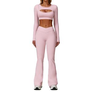 Conjuntos de yoga de diseño nuevo, personalizados por OEM, con top corto de manga larga con sujetador incorporado y leggings acampanados, conjunto de 2 piezas para mujer. - Product Image 5