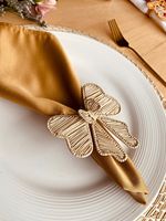 Rond de serviette en rotin décoratif élégant pour les espaces d'événements de restaurants et les paramètres de table de dîner à domicile haut de gamme