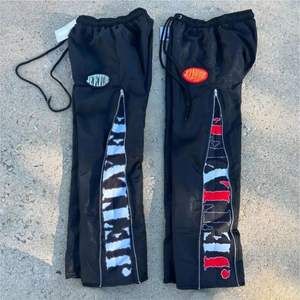 กางเกงไนลอนผู้ชายออกแบบได้ตามต้องการมีซิปน้ำหนักเบาพิมพ์ตัวอักษรน้ำหนักเบาเสื้อผ้าแนวสตรีทแบบลำลองกันน้ำ - Product Image 4