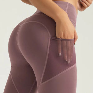 Pantalon de yoga capri taille haute avec logo personnalisé pour femmes avec poche latérale en maille transparente Nouveau design Vêtements de sport à motif solide - Product Image 1