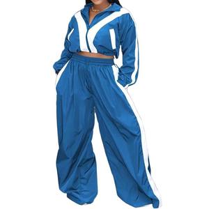 Chándal cortavientos deportivo de nailon para mujer, Chaqueta corta con pantalón acampanado, ropa para adultos, chándal de calidad premium OEM - Product Image 1