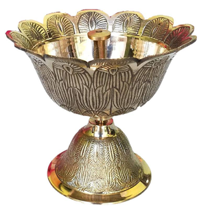 Ornately carved brass diya <b>lamp</b> with a detailed <b>lotus</b> petal design on a flared base, great for pooja, available at wholesale - Product Image 1