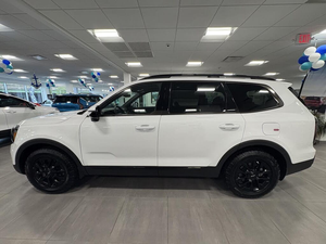 Clean White 2025 K i a Tell uride SX-Prestige X-Pro AWD con asientos de cuero Sistema de navegación Asientos de tercera fila Asientos calefactables - Product Image 4