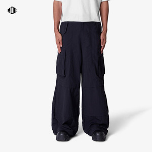 Pantalones de nailon con cordón holgados transpirables a prueba de viento para hombre bolsillos de carga personalizados impermeables frente plano estilo ancho de gran tamaño - Product Image 1